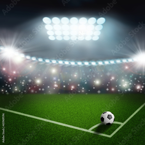 soccer ball on the green field corner
