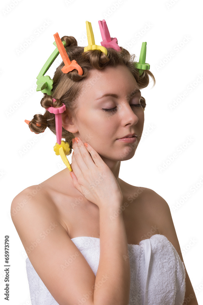 Pretty woman with closed eyes and curlers on hair. Pretty woman with closed eyes and curlers on hair.