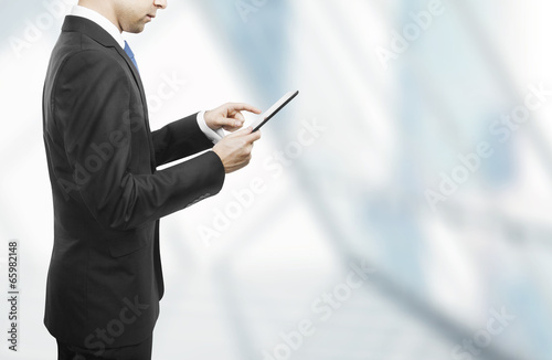 businessman holding touch pad