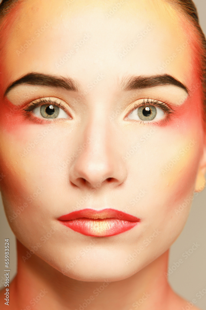 beautiful make up of bright lips, isolated on grey background beautiful make up of bright lips, isolated on grey background
