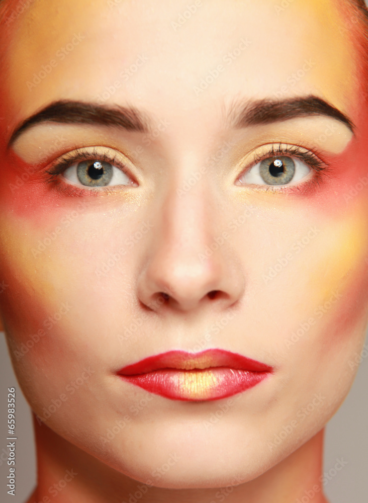 beautiful make up of bright lips, isolated on grey background beautiful make up of bright lips, isolated on grey background