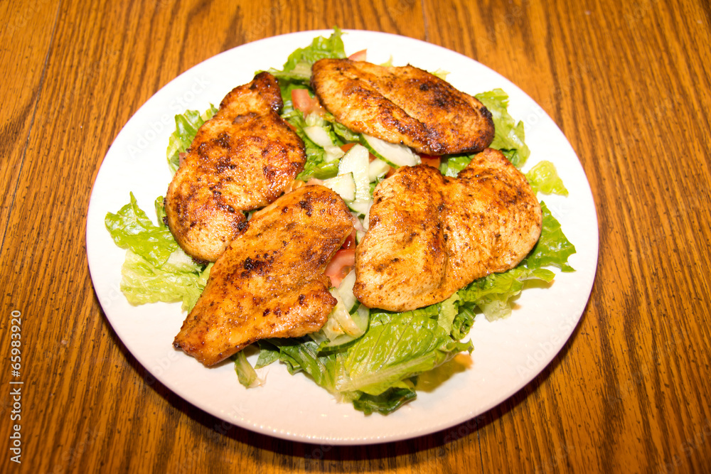 Lettuce and cucumber salad with barbecue chicken