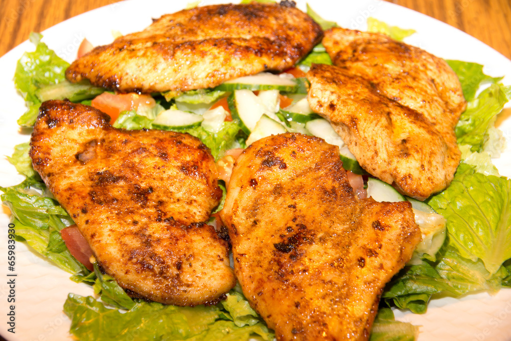 Lettuce and cucumber salad with barbecue chicken