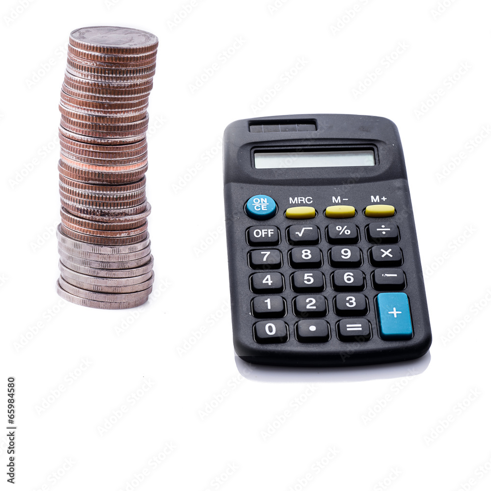 Coins and calculator on white background Coins and calculator on white background