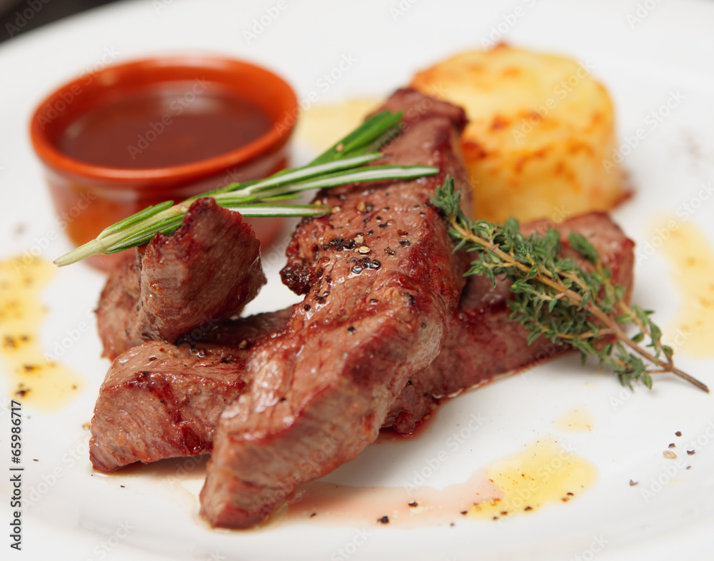 Grilled beef ribs on plate