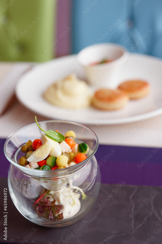 Vegetable appetizer in creative glassware