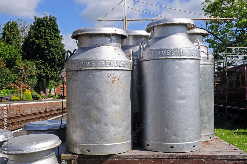 Milk churns on railway platform © Arena Photo UK