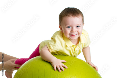 kid on gymnastic ball