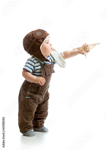 Kid boy playing with wooden...