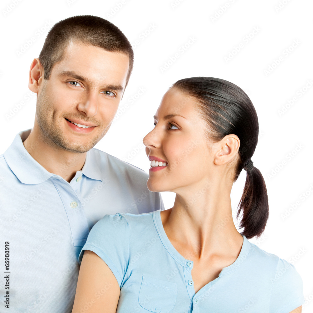 Portrait of young happy smiling attractive couple, isolated on w Portrait of young happy smiling attractive couple, isolated on w
