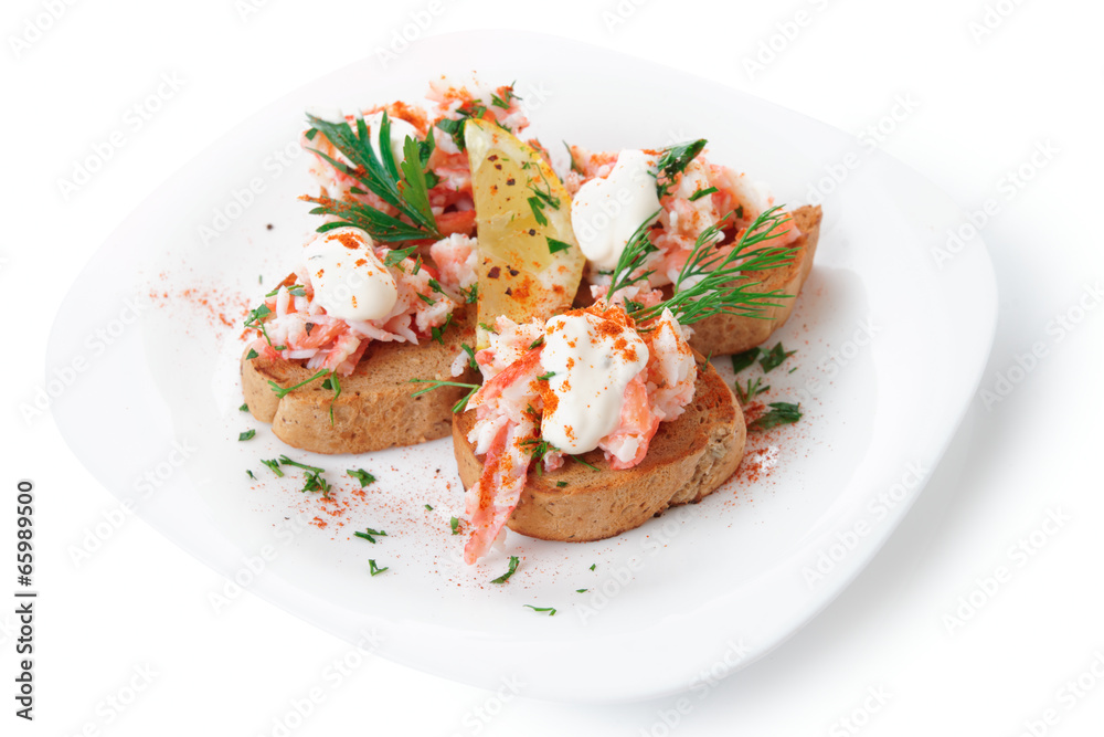 Crab meat with toast, sauce and fresh herbs Crab meat with toast, sauce and fresh herbs