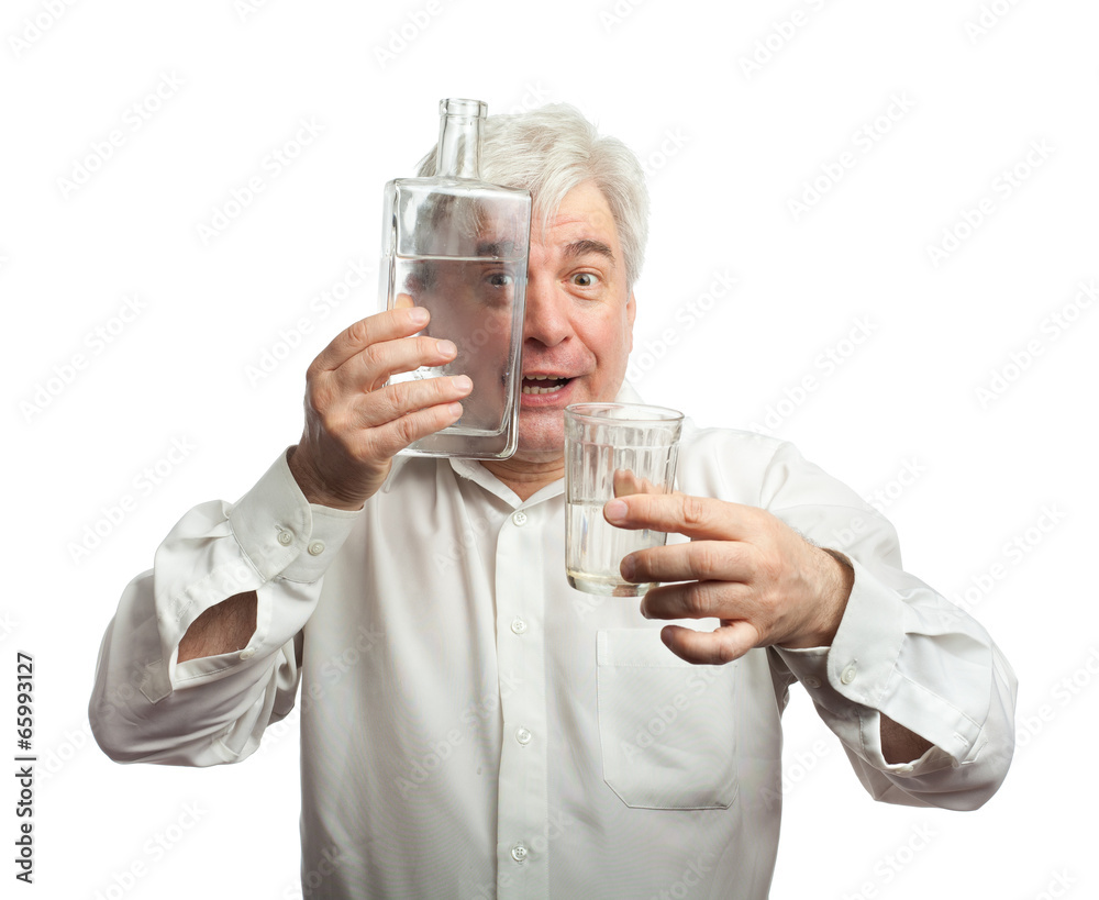 A man with a bottle of vodka and a glass. A man with a bottle of vodka and a glass.