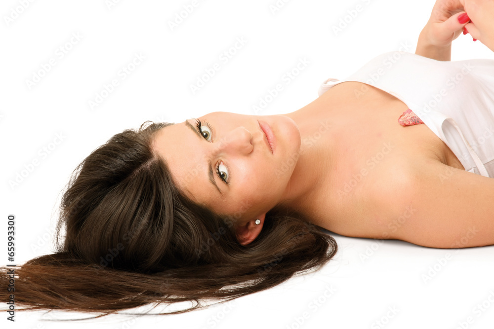 Portrait of a beautiful woman lying on the floor Portrait of a beautiful woman lying on the floor