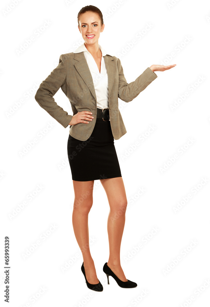 young woman pointing at something, isolated on white background young woman pointing at something, isolated on white background