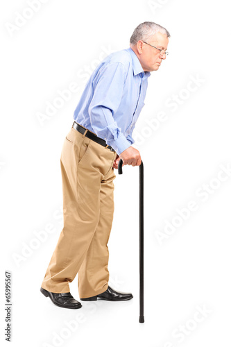 Old man walking with cane