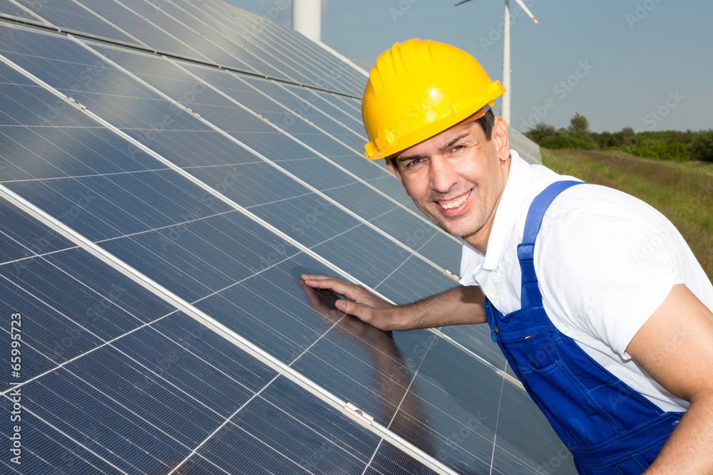 Engineer or installer inspecting solar energy panels