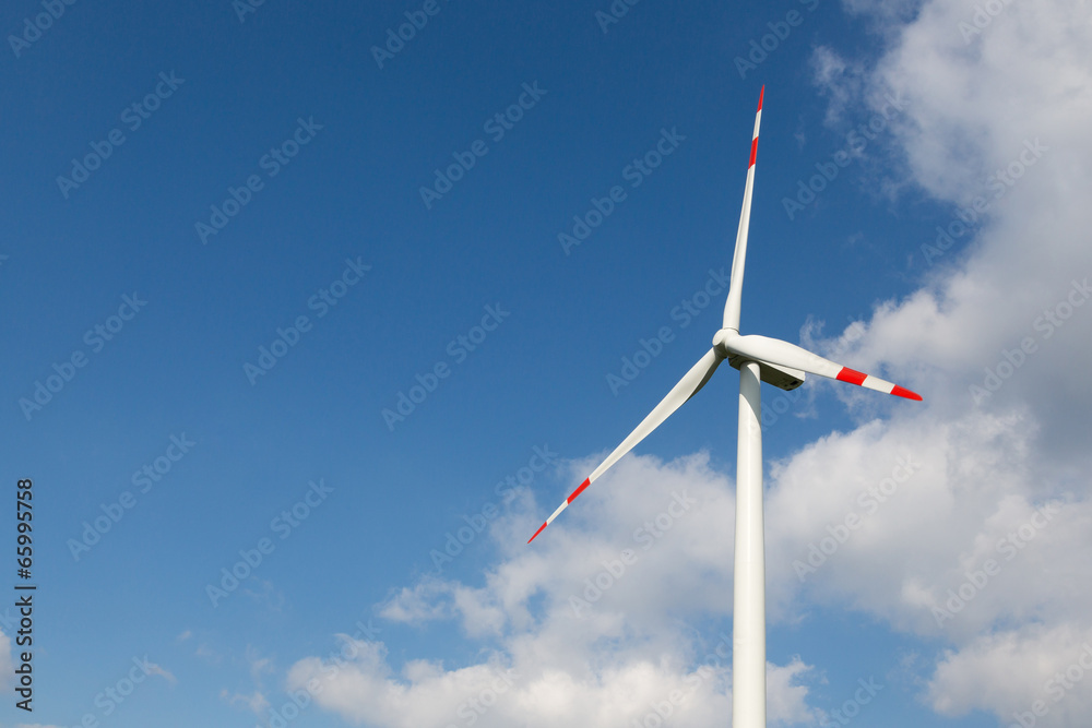 Wind turbine for clean energy production with blue sky Wind turbine for clean energy production with blue sky