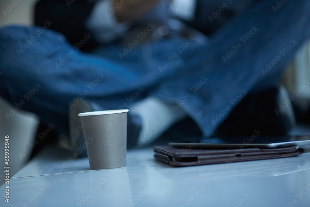 men with pc tablet and coffee