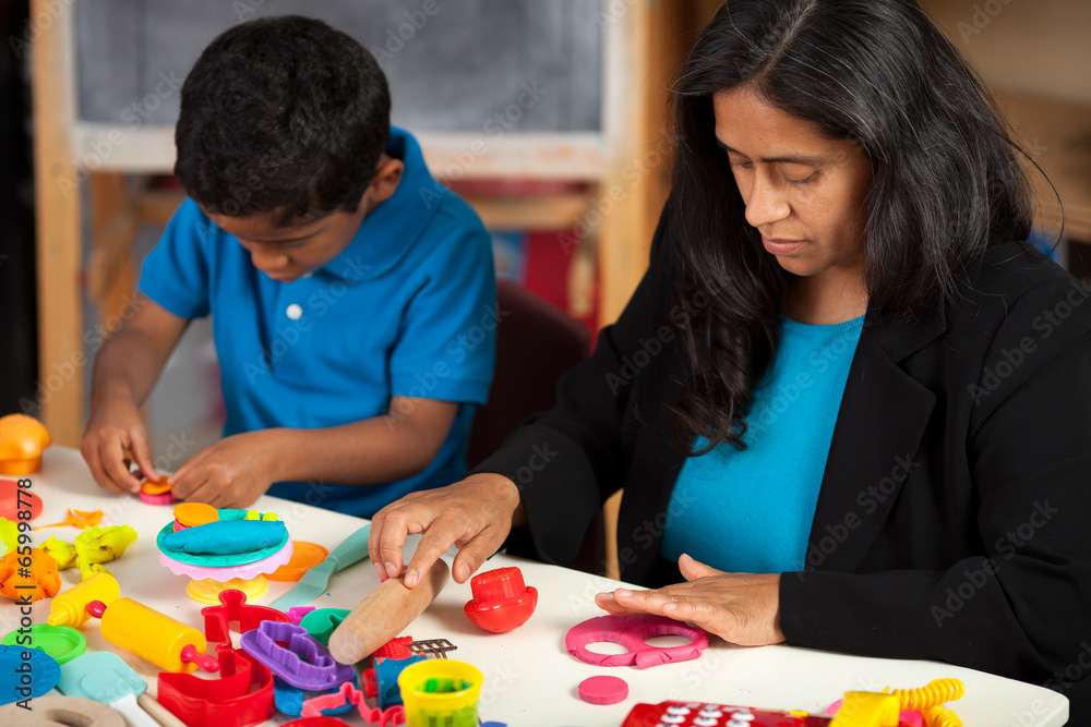 Fototapeta premium Hispanic Mom and Child in Home School Setting
