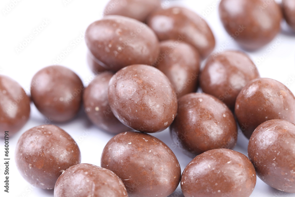 Dark brown dragee in chocolate cover. Dark brown dragee in chocolate cover.