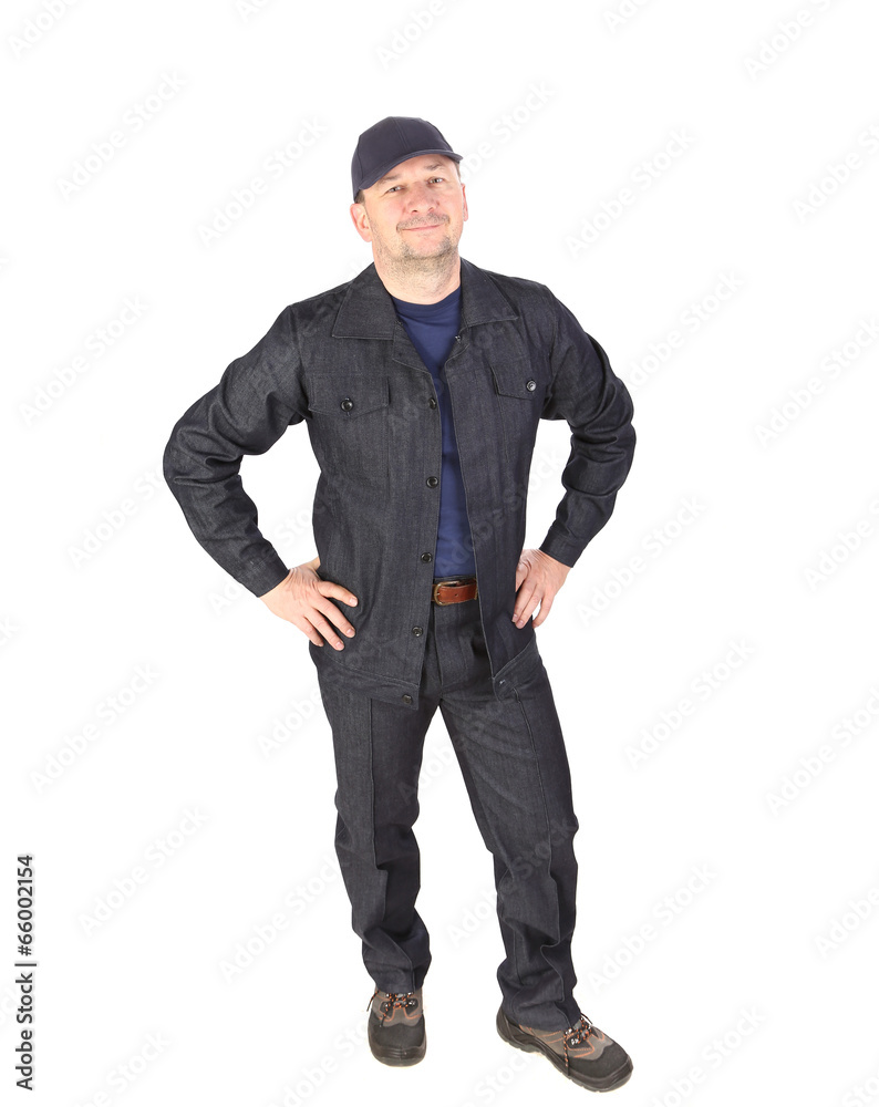 Fototapeta premium Worker in cap with hands on hips.