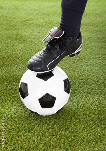 Low Section Of Player's Leg On Soccer Ball