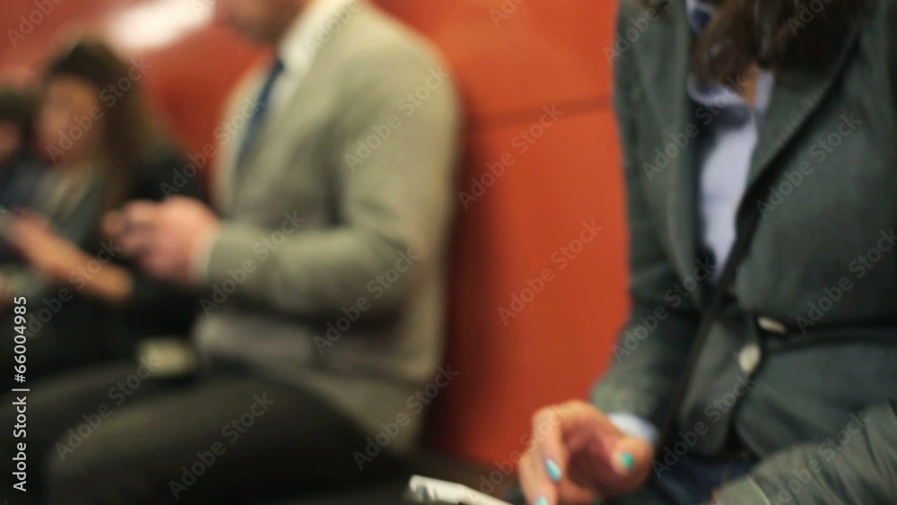 Businesswoman texting on smartphone in the city Businesswoman texting on smartphone in the city