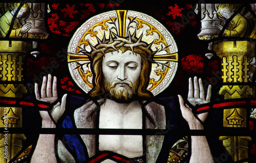 Jesus Christ showing with his stigmata in stained glass