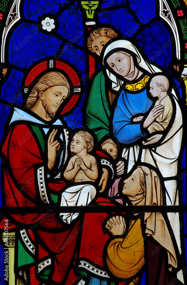 Jesus Christ blessing a child in stained glass