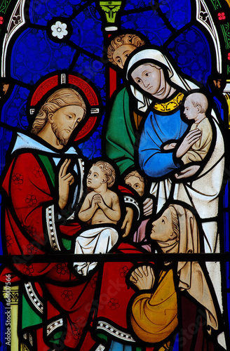 Jesus Christ blessing a child in stained glass