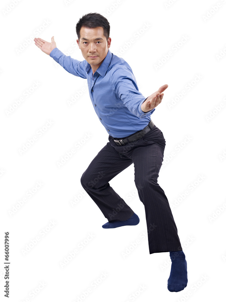 asian businessman showing karate move asian businessman showing karate move