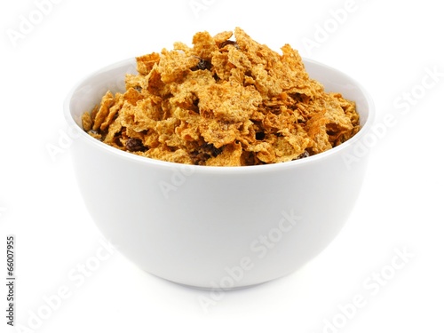 Fotografija Bowl of bran flakes cereal on a white background