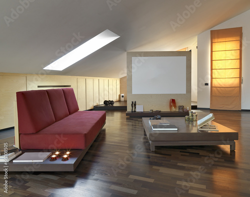 red fabric sofa in a modern living room in the panthouse