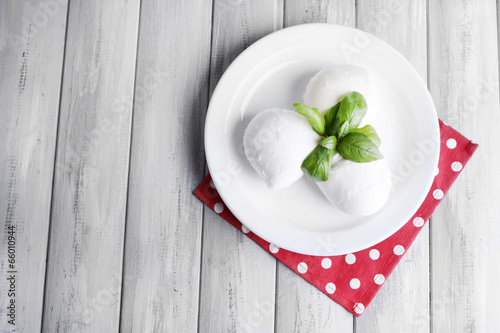 Tasty mozzarella cheese with basil photo