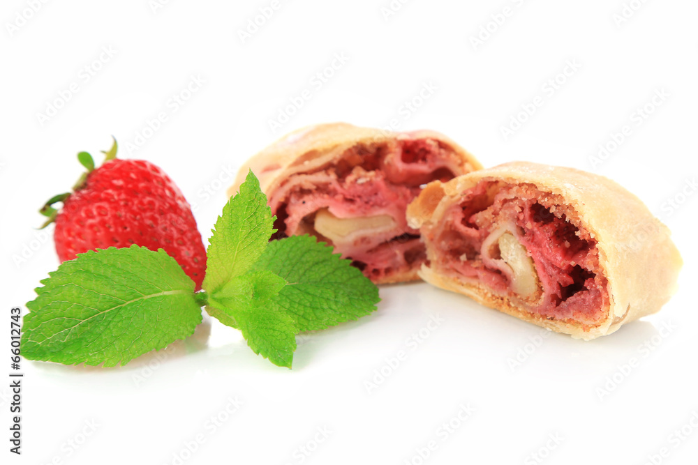 Tasty homemade strudel with fresh strawberry and mint leaves
