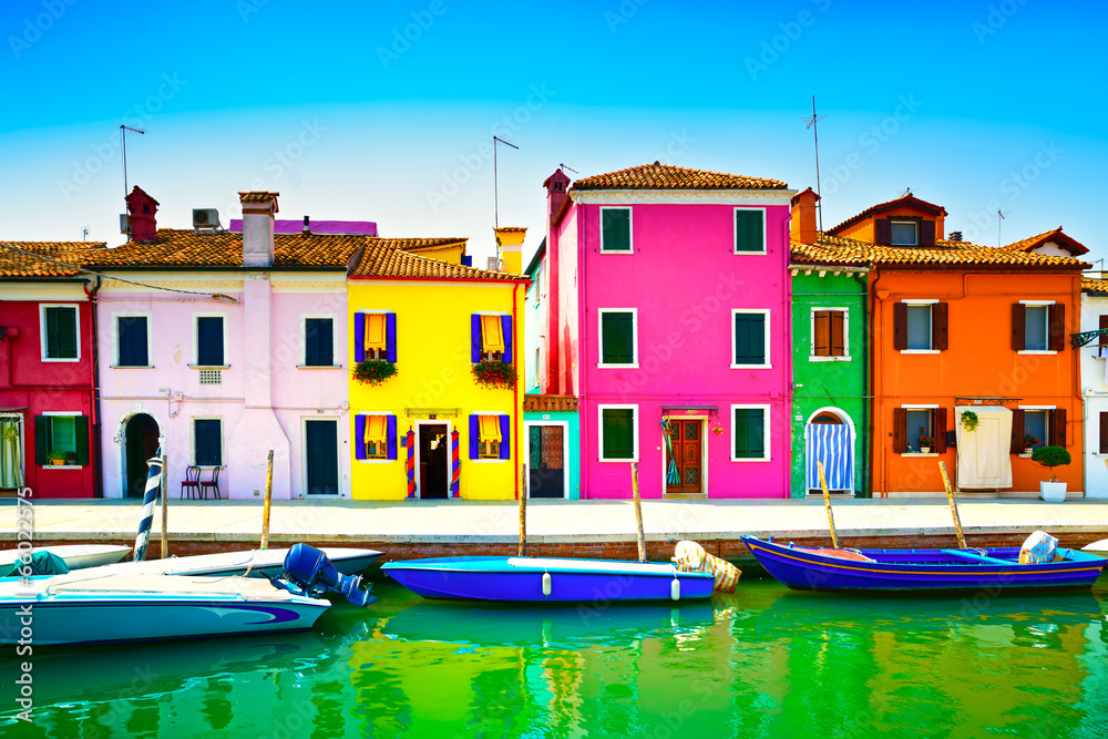 Venice landmark, Burano island canal, colorful houses and boats,