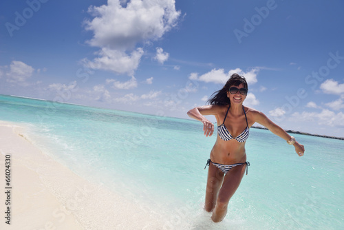 beautiful young woman on beach have fun and relax