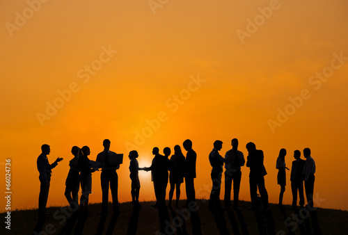Business People Working Outdoors With A View Of Sunset