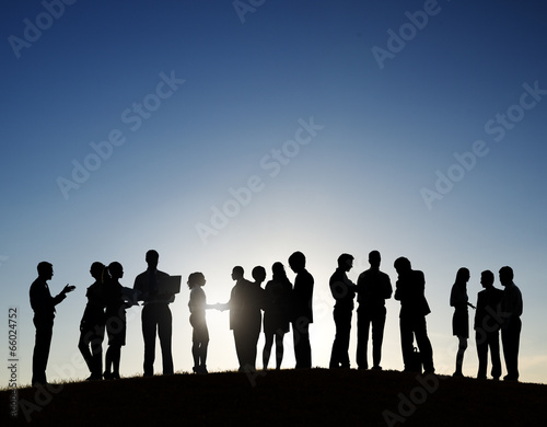 Silhouettes of Business People on a Meeting Outdoors