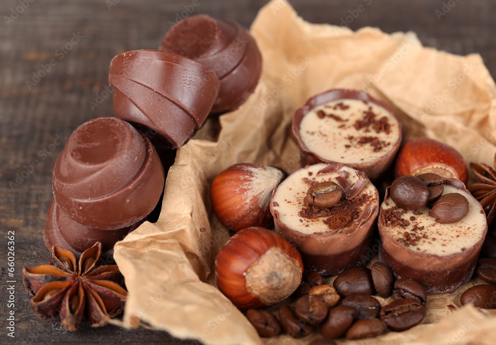 Tasty chocolate candies with coffee beans and nuts