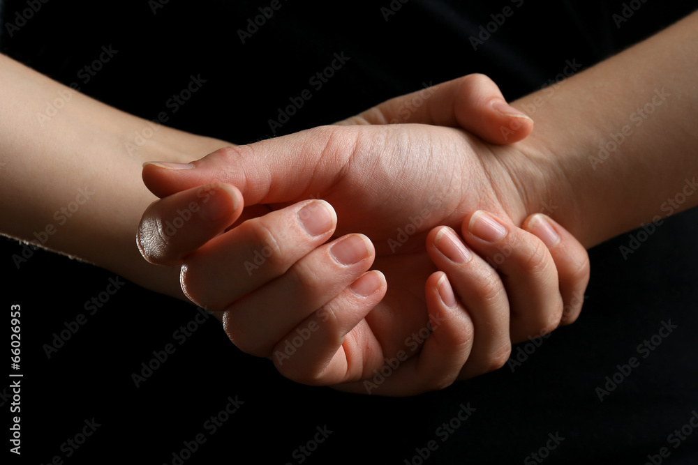 Human hands on black background Human hands on black background