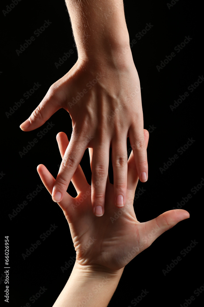 Fototapeta premium Human hands on black background