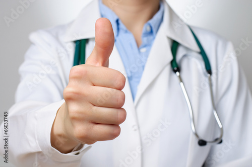 Doctor with thumbs up gesture