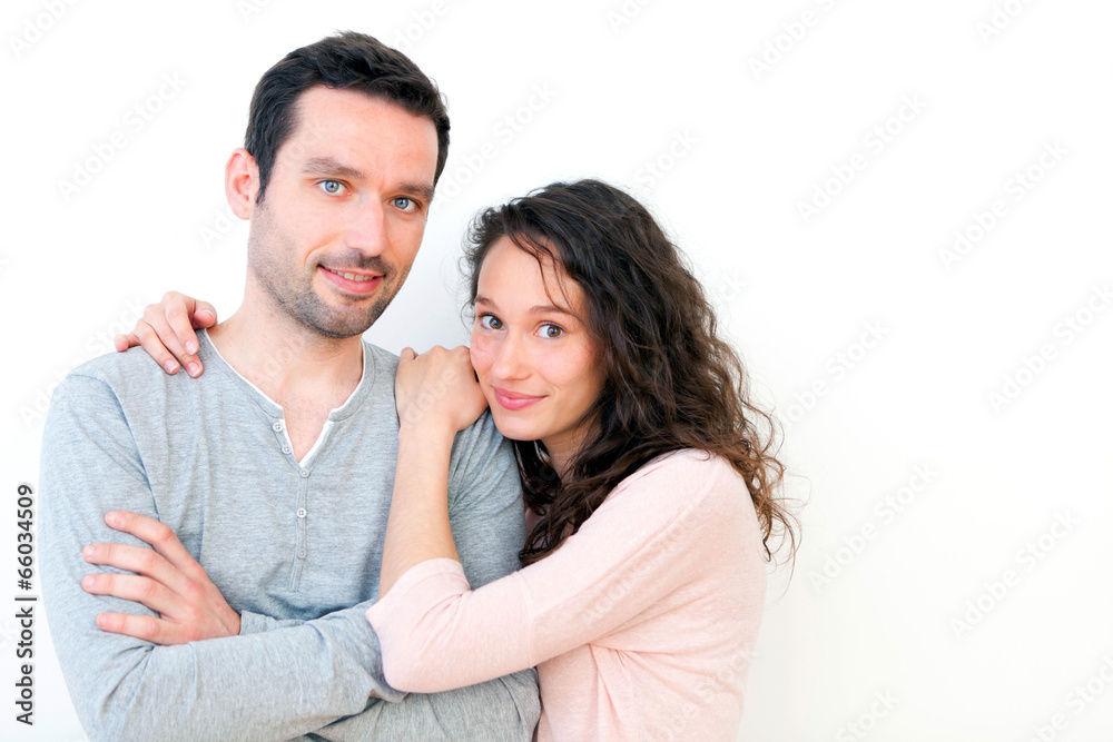 Portrait of a young happy couple on a white background