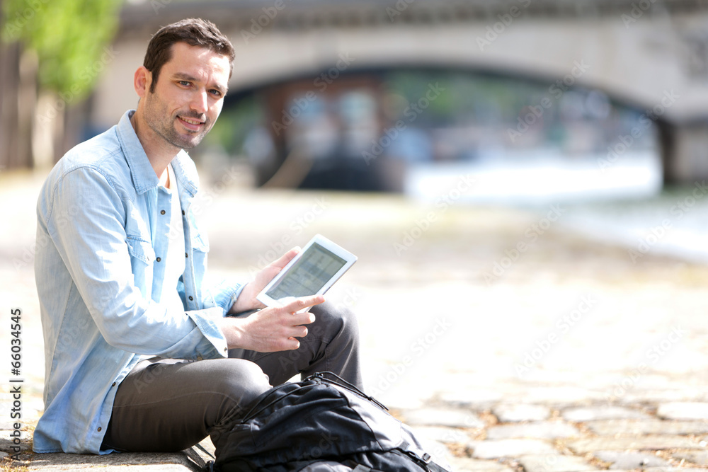Young attractive tourist using tablet in Paris Young attractive tourist using tablet in Paris