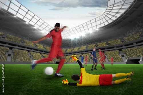 Composite image of football match in progress © WavebreakMediaMicro