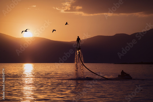 Flyboard at sunset photo
