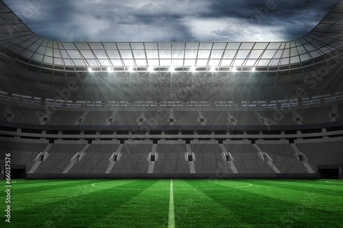 Large empty football stadium with lights