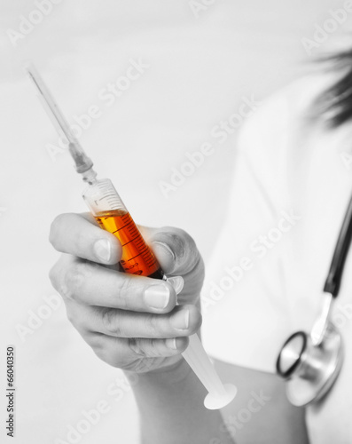 Nurse filling the syringe