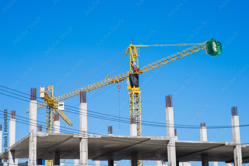 Big yellow crane in constuction site